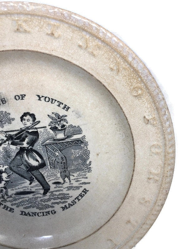 Late 1800s on sale child metal alphabet plate